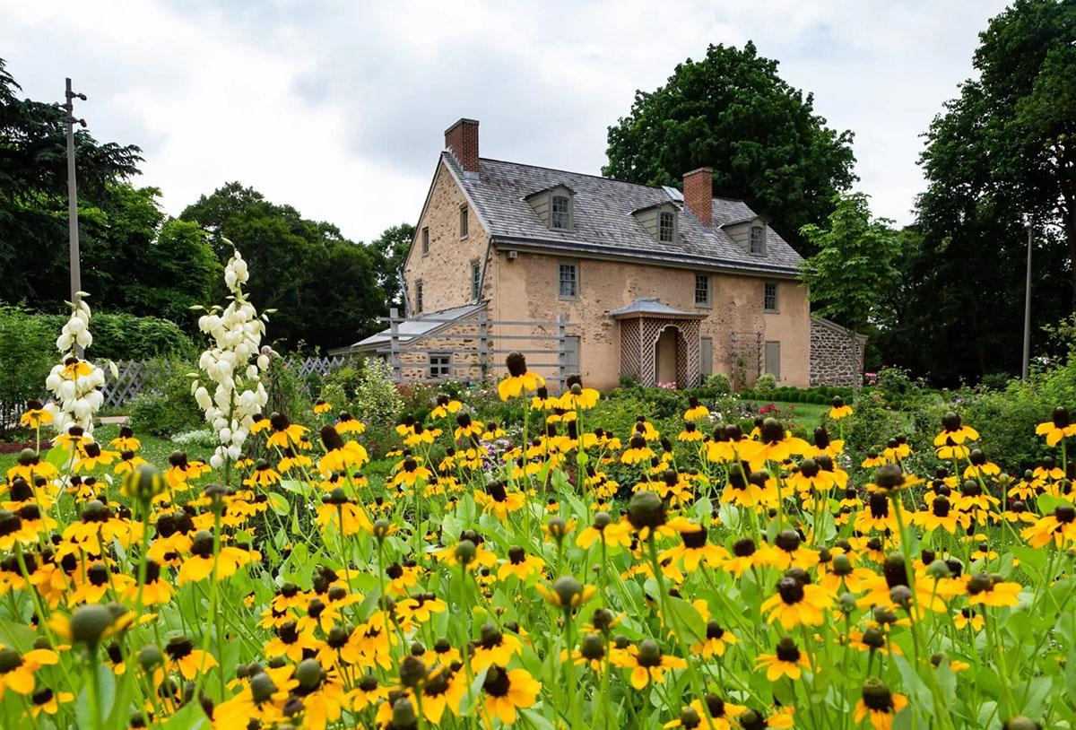 Historic stone Bartram House seen from the Ann Bartram Carr Garden in Southwest Philadelphia